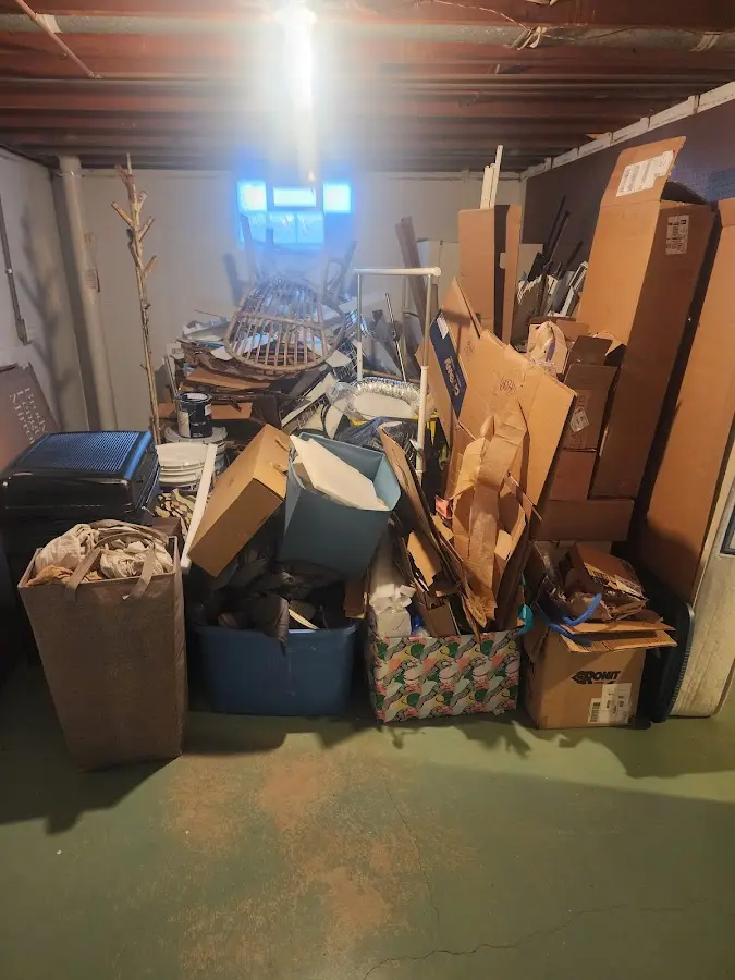 Roll-off dumpster container at job site for 2 Yard Dumpster Rental in Pueblo West